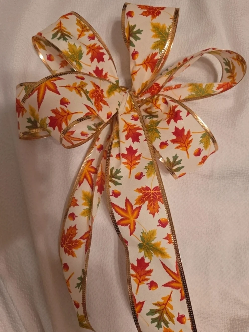 Festive Autumn Leaf Holiday Bow Ribbon - White with Orange, Red & Green Leaves